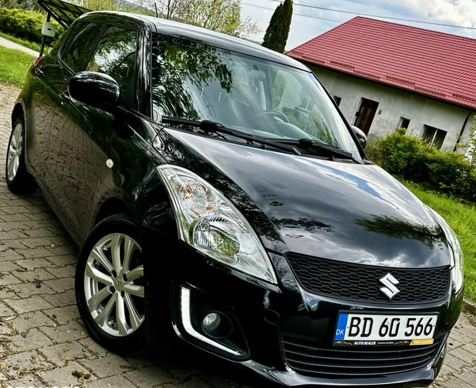 warmińsko-mazurskie Suzuki Swift cena 27900 przebieg: 95000, rok produkcji 2014 z Bełchatów